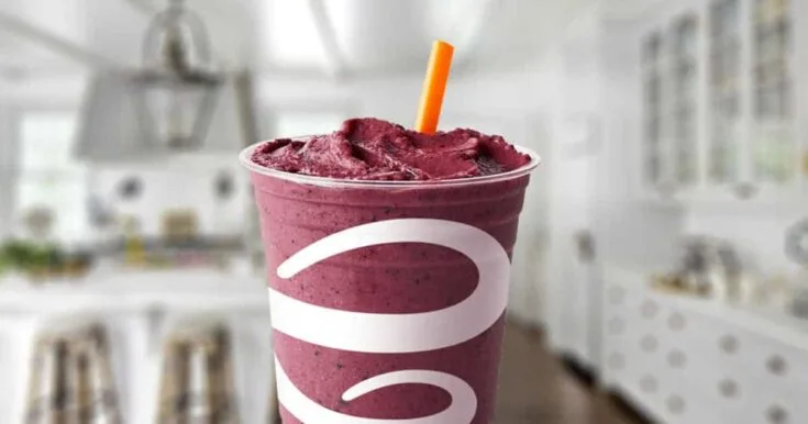 Jamba Juice Acai Super-Antioxidant Smoothie 9 Jamba Juice Acai Super-Antioxidant smoothie in a glass, on my kitchen counter, surrounded by fresh acai berries.