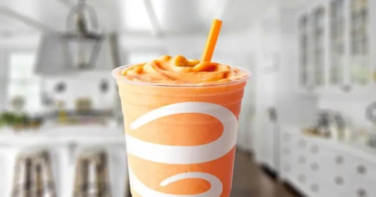 Jamba Juice Orange Carrot Karma Smoothie 6 Jamba Juice Orange Carrot Karma smoothie in a glass, on my kitchen counter, surrounded by carrots.