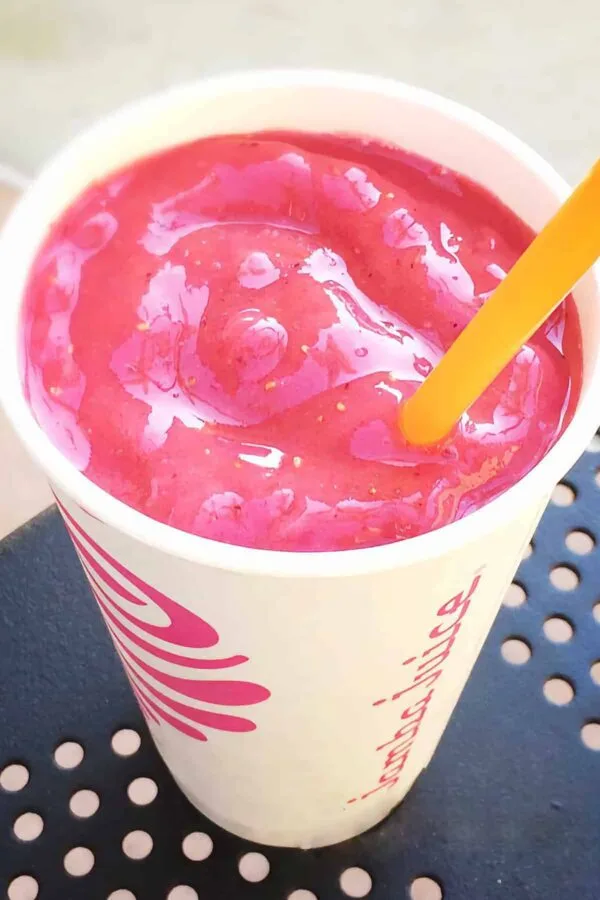 Jamba Juice Secret Menu Blue Gummy Bear smoothie in a glass, at the store.