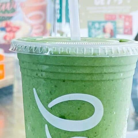 Jamba Juice Secret Menu Green Apple smoothie in a glass, at the store.
