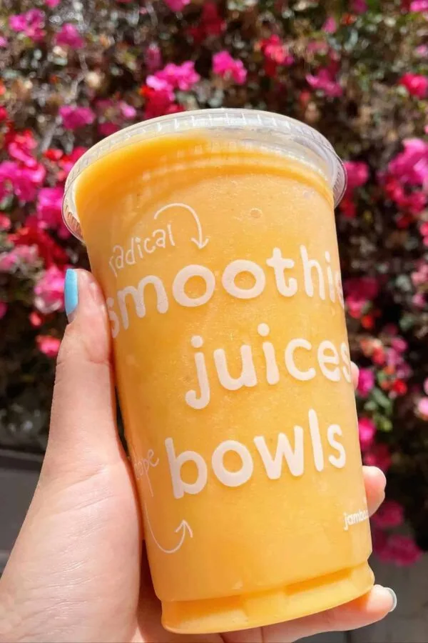 Jamba Juice Secret Menu Orange Whip smoothie in a glass, at the store.