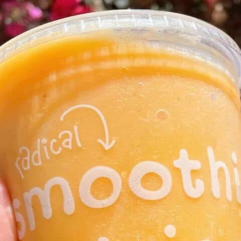 Jamba Juice Secret Menu Orange Whip smoothie in a glass, at the store.