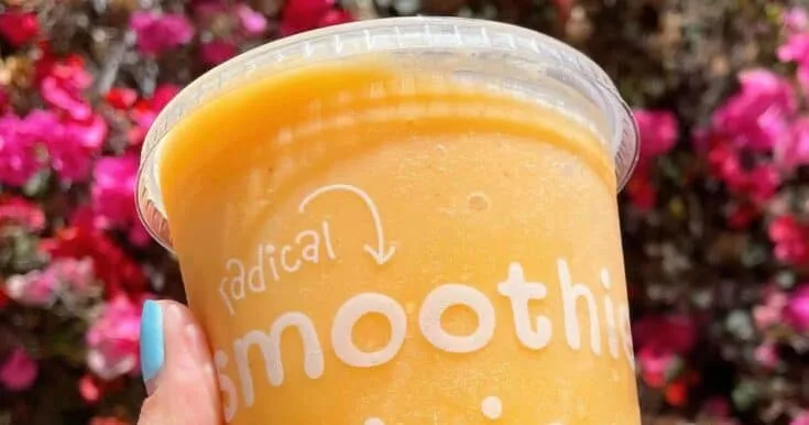 Jamba Juice Secret Menu Orange Whip smoothie in a glass, at the store.