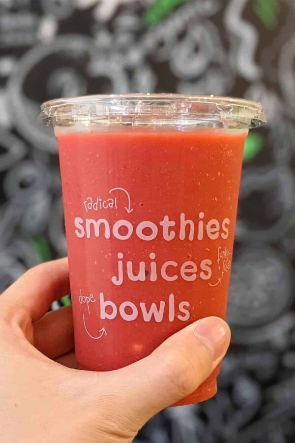 Jamba Juice Secret Menu Pacific Passion smoothie in a glass, at the store.