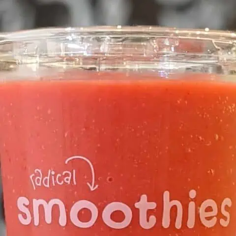 Jamba Juice Secret Menu Pacific Passion smoothie in a glass, at the store.