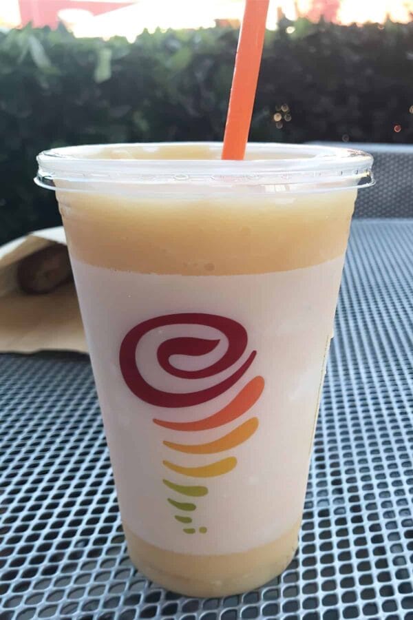 Jamba Juice Secret Menu Peaches And Cream smoothie in a glass, outdoors.