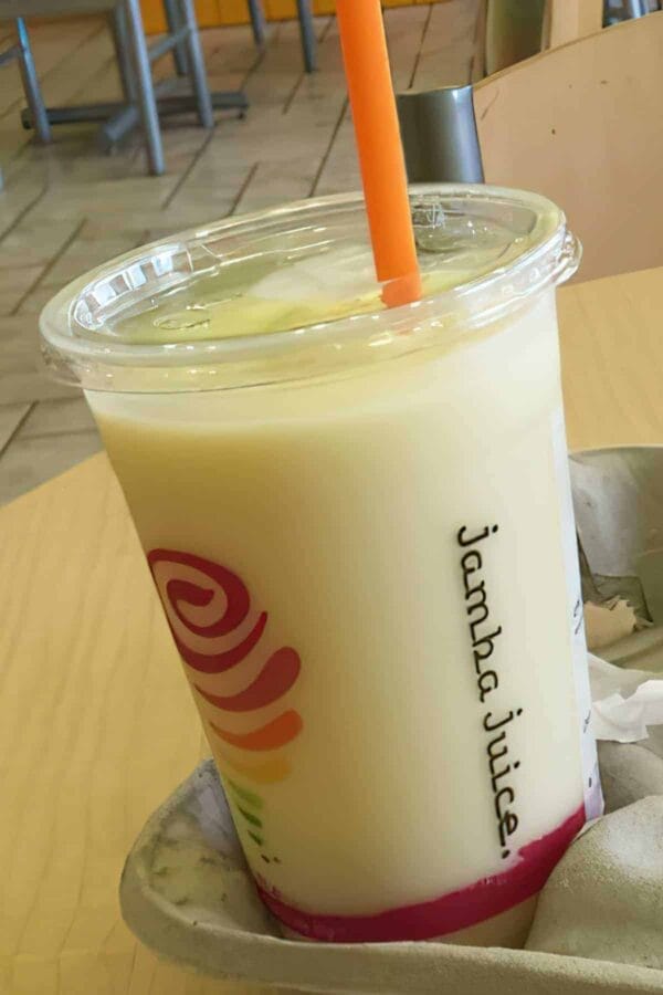 Jamba Juice Secret Menu Pineapple Dream Machine smoothie in a glass, at the store.