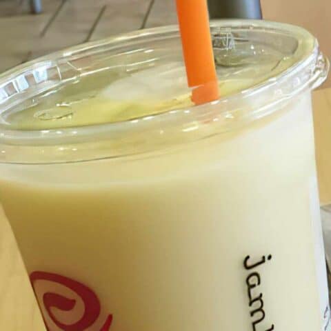 Jamba Juice Secret Menu Pineapple Dream Machine smoothie in a glass, at the store.