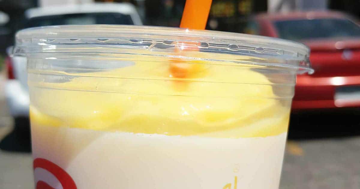 Jamba Juice Secret Menu Pineapple Dreamin' smoothie in a glass, at the store.