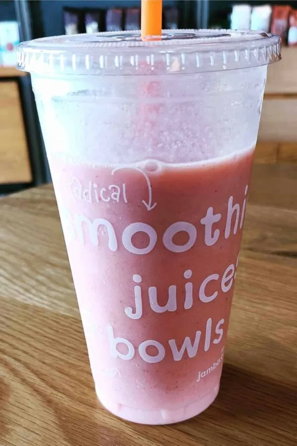 Jamba Juice Secret Menu Rainbow Sherbet smoothie in a glass, on my kitchen counter.