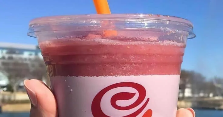 Jamba Juice Secret Menu Raspberry Dreamin' Smoothie 6 Jamba Juice Secret Menu Raspberry Dreamin' smoothie in a glass, outdoors.