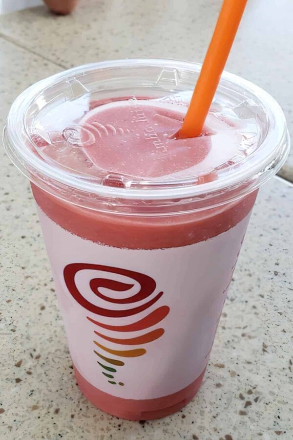 Jamba Juice Secret Menu Raspberry Shortcake smoothie in a glass, on my kitchen counter.