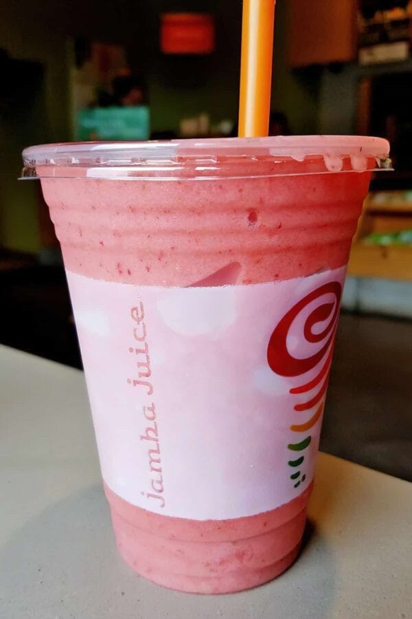 Jamba Juice Secret Menu Strawberry Cheesecake smoothie in a glass, on my kitchen counter.