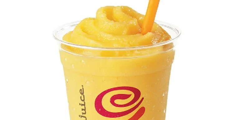 Jamba Juice Secret Menu Tropical Awakening Smoothie 7 Jamba Juice Secret Menu Tropical Awakening smoothie in a glass, on my kitchen counter, surrounded by fresh fruit.