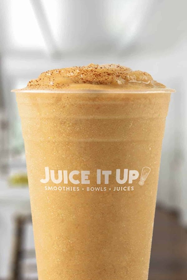 Juice It Up Chili Lime Mango smoothie in a glass, on my kitchen counter.