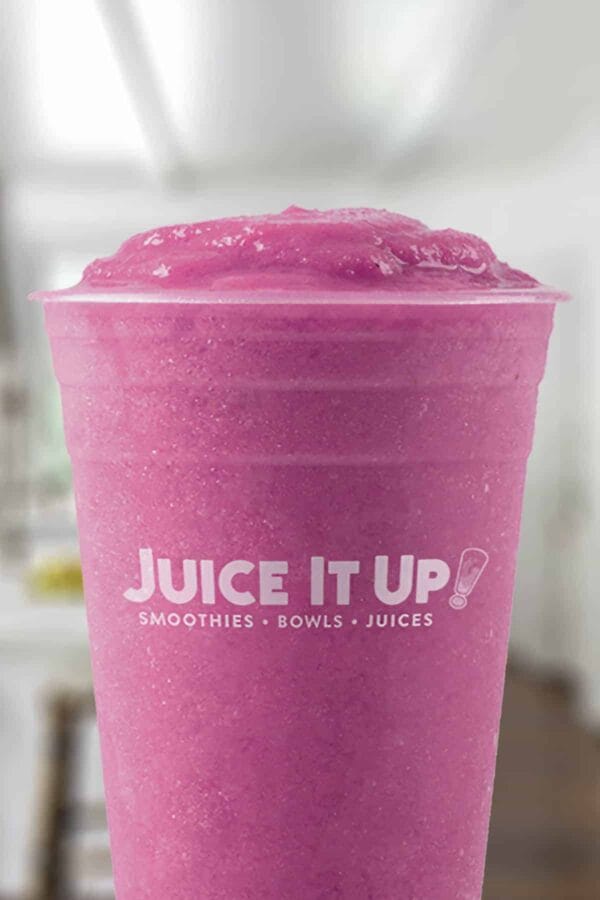 Juice It Up Dragon Fruit Sunset smoothie in a glass, on my kitchen counter.