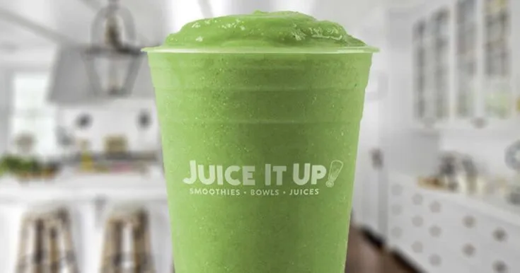 Juice It Up Ever Green smoothie in a glass, on my kitchen counter.