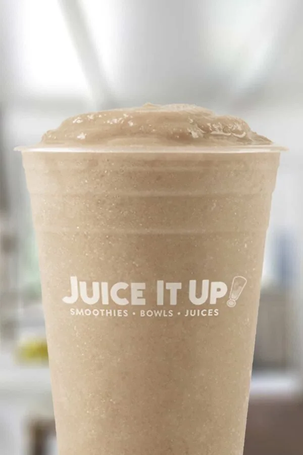 Juice It Up PB Cold Brew Mocha smoothie in a glass, on my kitchen counter.