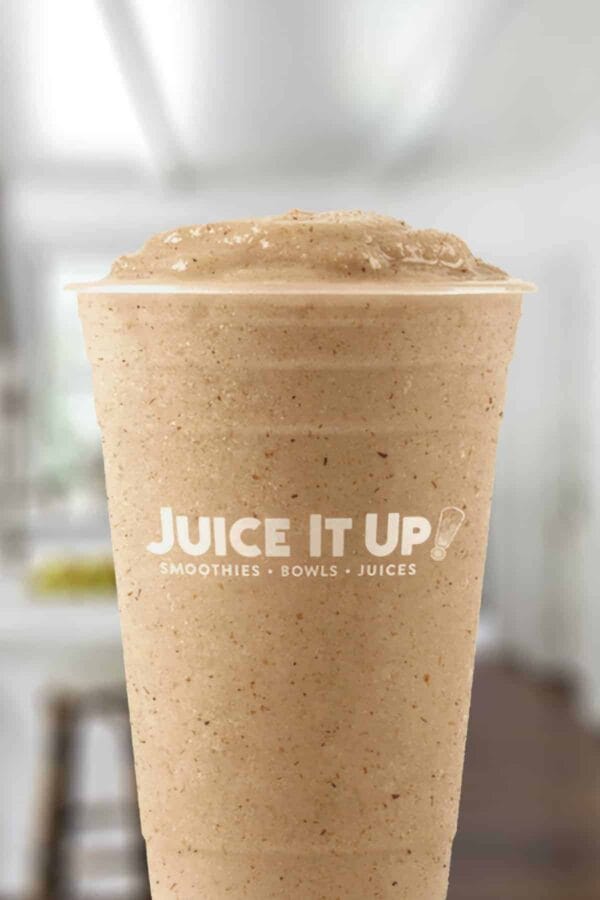 Juice It Up PB Horchata smoothie in a glass, on my kitchen counter.