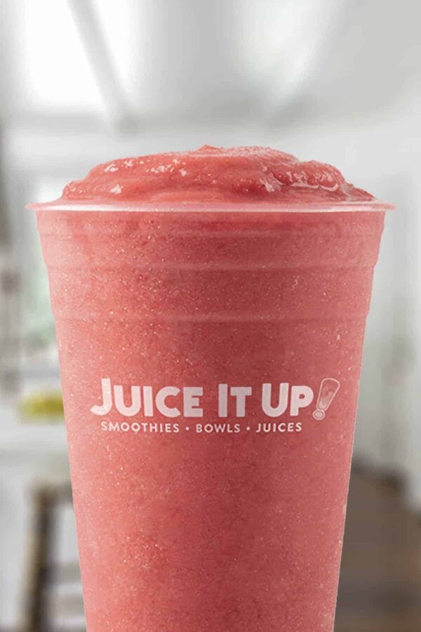 Juice It Up Raspberry Craze smoothie in a glass, on my kitchen counter.