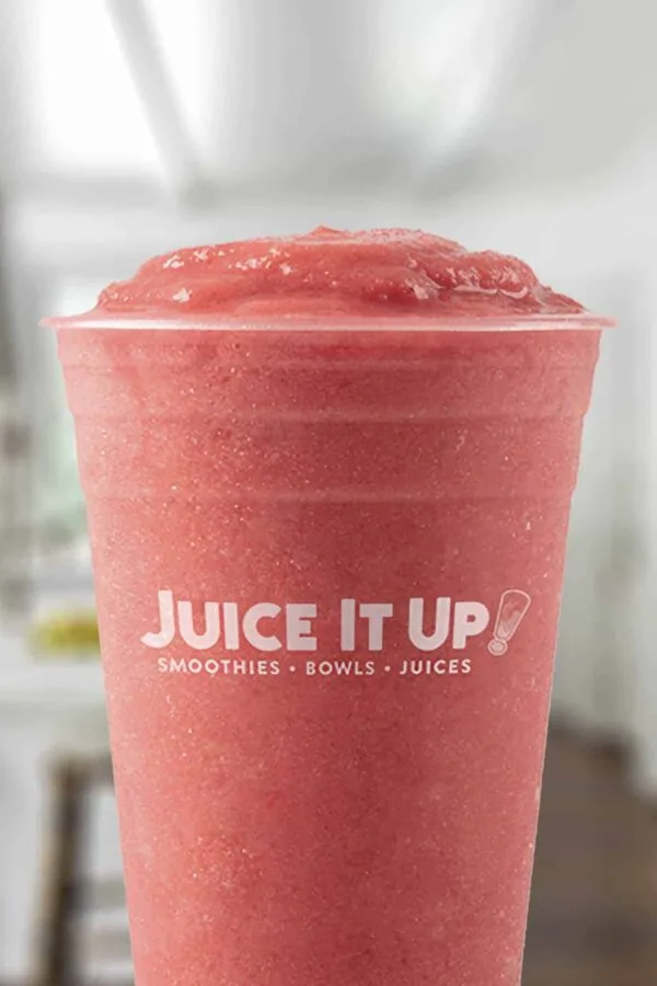 Juice It Up Raspberry Craze smoothie in a glass, on my kitchen counter.