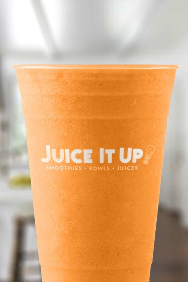 Juice It Up The Turmeric smoothie in a glass, on my kitchen counter.