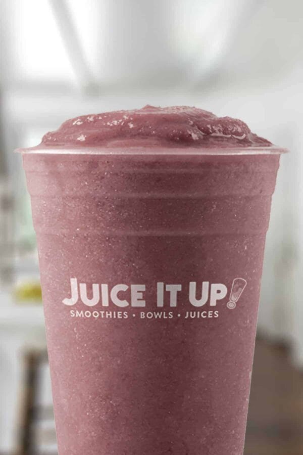 Juice It Up Ultimate Açaí smoothie in a glass, on my kitchen counter.