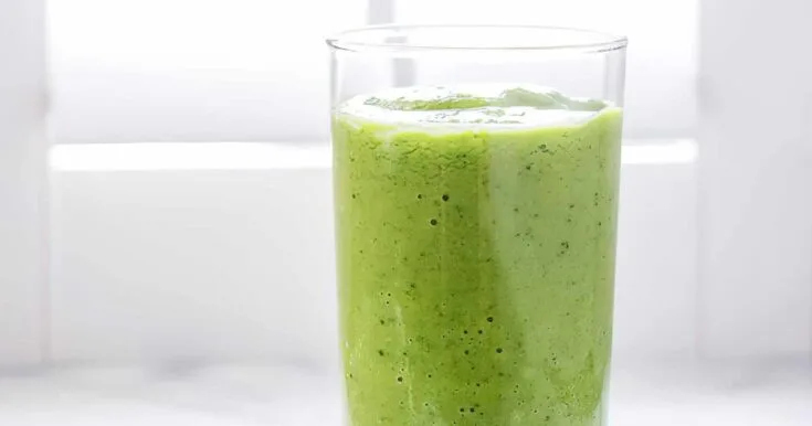 NutriBullet Cleansing Green Smoothie 10 NutriBullet Cleansing Green smoothie in a glass, on my kitchen counter.