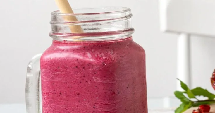Vitamix Beet Strawberry Cranberry Smoothie 7 Vitamix Beet Strawberry Cranberry smoothie in a glass, on my kitchen counter, surrounded by fresh fruit and vegetables.