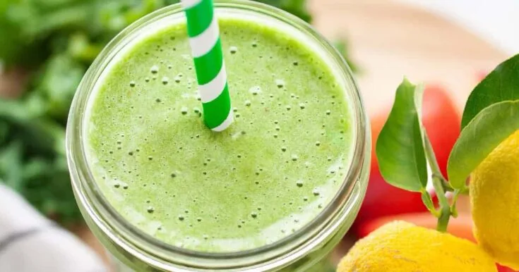 Vitamix Winter Green Yuzu Smoothie 7 Vitamix Winter Green Yuzu smoothie in a glass, on my kitchen counter, surrounded by fresh fruit and vegetables.