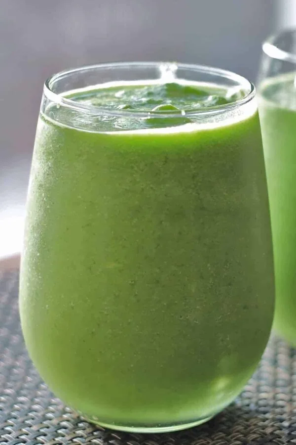 Ninja Blender Emerald Green Elixir smoothie in a glass, on my kitchen counter.