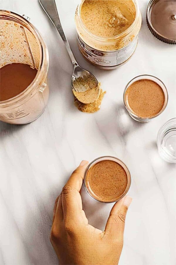 Ninja Blender Icy Almond Cacao Shot smoothie in a glass, on my kitchen counter.
