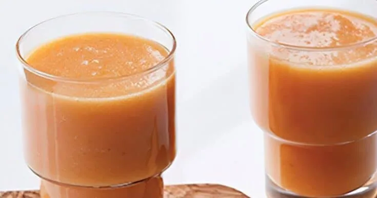 Ninja Blender Island Sunrise smoothie in a glass, on my kitchen counter.