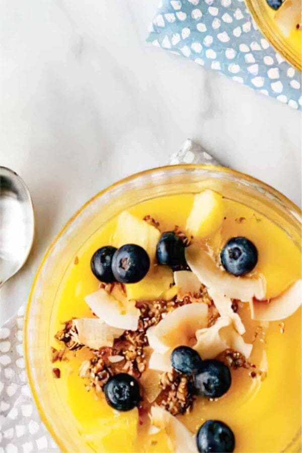 Ninja Blender Mango Coconut smoothie in a glass, on my kitchen table.