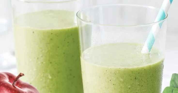 NutriBullet Fiberlicious Smoothie 10 NutriBullet Fiberlicious smoothie in a glass, on my kitchen counter, surrounded by fresh fruit and vegetables.