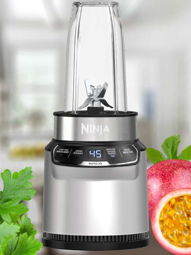 Ninja Blender blending a Ninja smoothie, on my kitchen counter, surrounded by fresh fruit and vegetables.