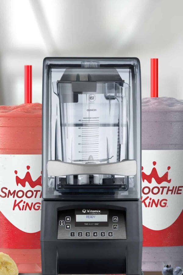 Vitamix The Quiet One blender, on my kitchen counter, surrounded by Smoothie King smoothies.