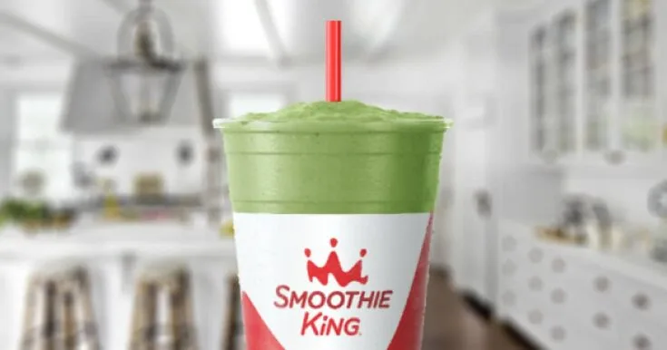 Smoothie King Power Meal Spinach Pineapple 8 Smoothie King Power Meal Spinach Pineapple smoothie in a glass, on my kitchen counter, surrounded by fresh fruit and vegetables.
