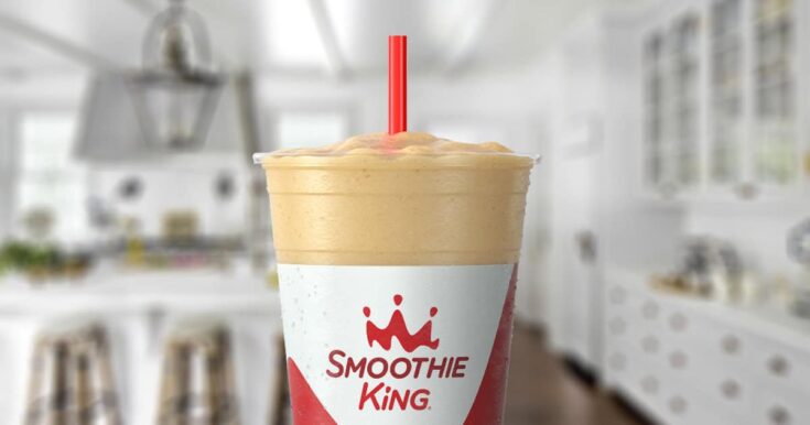 Smoothie King Original High Protein Lemon smoothie in a glass, on my kitchen counter, surrounded by almonds.