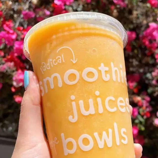 Jamba Juice Secret Menu Orange Whip smoothie in a glass, at the store.